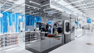 Cleveron 403 robotic parcel locker covered with mirrors due to the inability to install it behind a wall. This makes the machine functional, as more mirror surfaces are needed in a clothing store